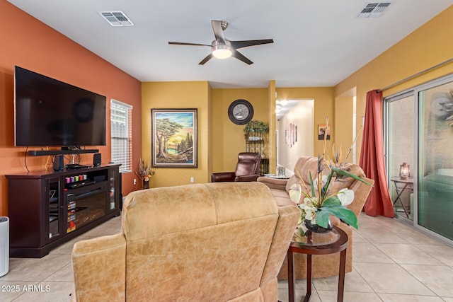 living room with ceiling fan and light tile patterned floors