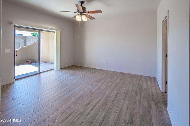 unfurnished bedroom with light wood-type flooring, access to outside, ceiling fan, and baseboards