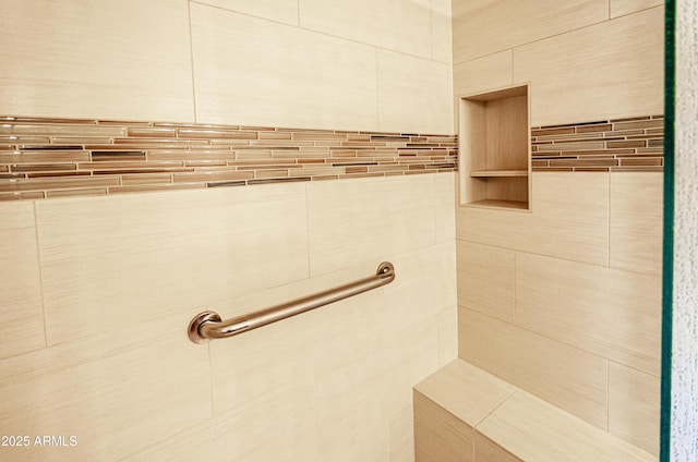 full bathroom with a tile shower