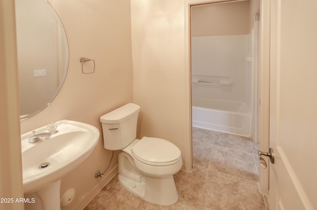 bathroom with toilet, tile patterned flooring, bathtub / shower combination, and a sink