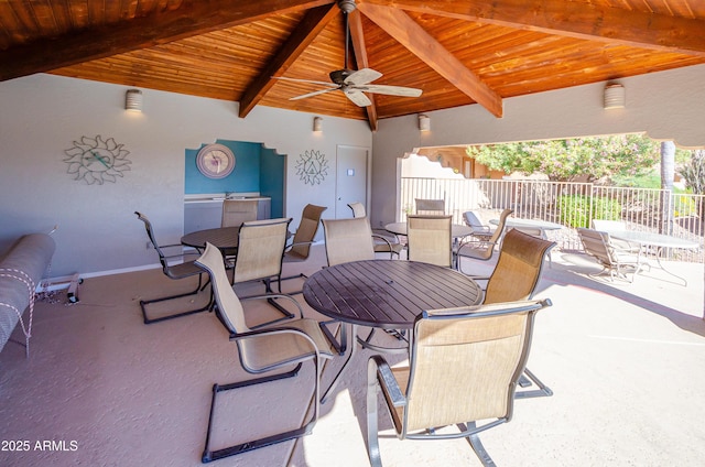 view of patio with a ceiling fan and fence