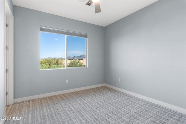 unfurnished room with ceiling fan