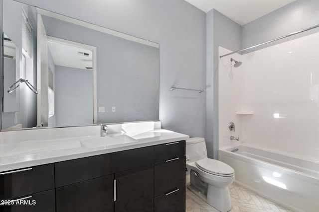 full bathroom featuring toilet, vanity, and shower / bathtub combination