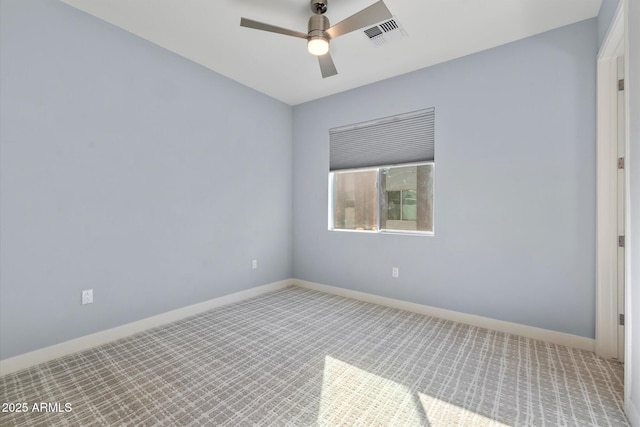 spare room with ceiling fan