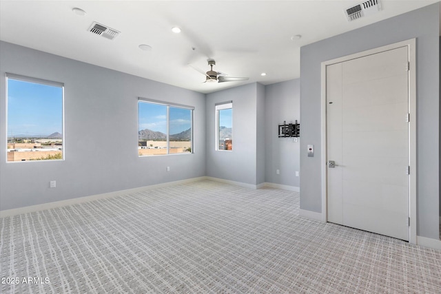 empty room featuring ceiling fan