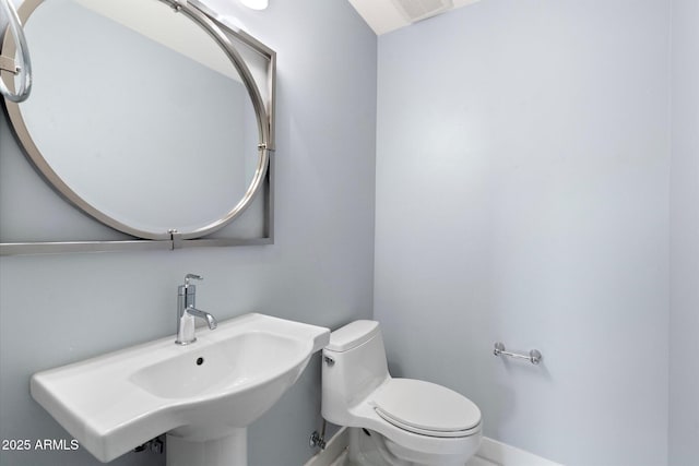 bathroom with toilet and sink