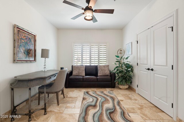 7734 E Monica Dr, Scottsdale, AZ 85255 - office area featuring stone tile flooring and ceiling fan