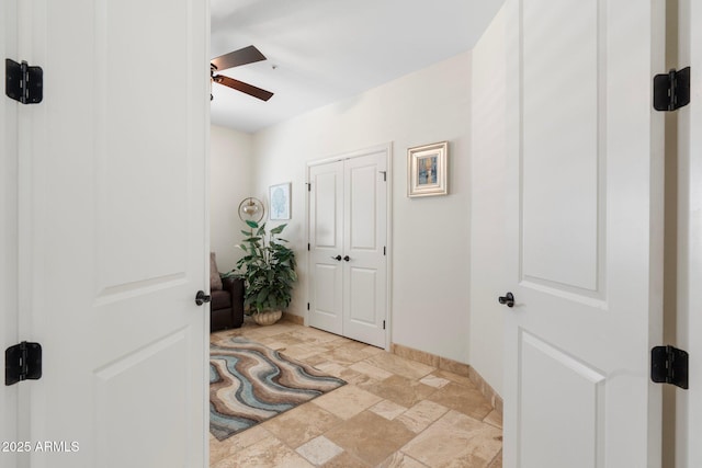 7734 E Monica Dr, Scottsdale, AZ 85255 - foyer entrance featuring a ceiling fan, stone finish flooring, and baseboards
