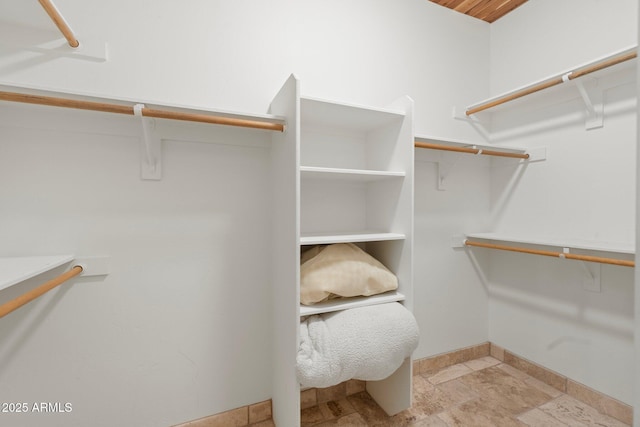 7734 E Monica Dr, Scottsdale, AZ 85255 - walk in closet with stone finish flooring