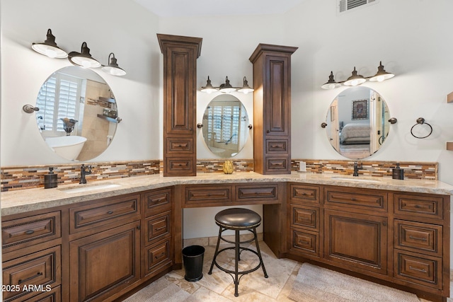 7734 E Monica Dr, Scottsdale, AZ 85255 - ensuite bathroom with double vanity and decorative backsplash