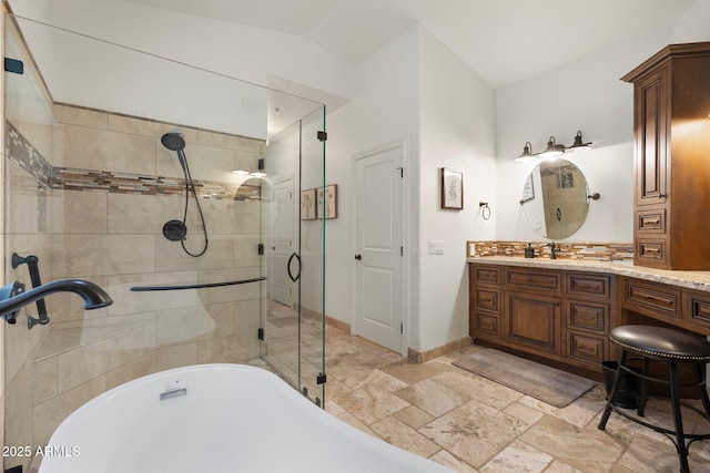 7734 E Monica Dr, Scottsdale, AZ 85255 - full bath with a soaking tub, a stall shower, vanity, baseboards, and stone tile flooring