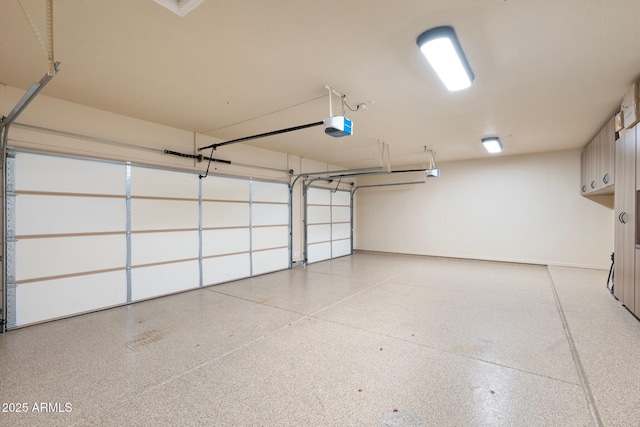 7734 E Monica Dr, Scottsdale, AZ 85255 - garage with a garage door opener and baseboards