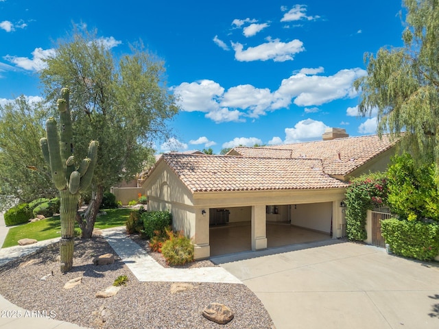 7734 E Monica Dr, Scottsdale, AZ 85255 - view of front of home featuring a tiled roof, stucco siding, a chimney, and concrete driveway