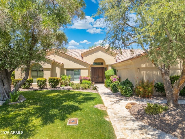 7734 E Monica Dr, Scottsdale, AZ 85255 - mediterranean / spanish-style home with stucco siding, a front yard, and a tiled roof