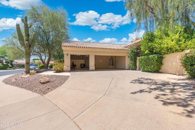 7734 E Monica Dr, Scottsdale, AZ 85255 - view of side of home featuring a tiled roof, stucco siding, driveway, and a garage