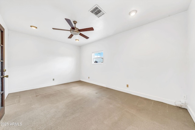 empty room with a ceiling fan, carpet floors, and baseboards