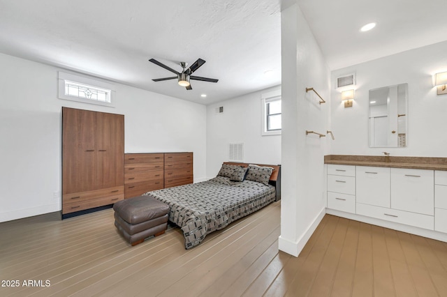 bedroom with hardwood / wood-style flooring, baseboards, recessed lighting, and ceiling fan