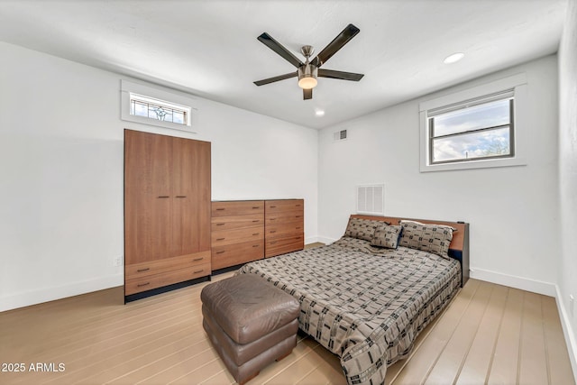 bedroom with light wood finished floors, baseboards, a ceiling fan, and recessed lighting