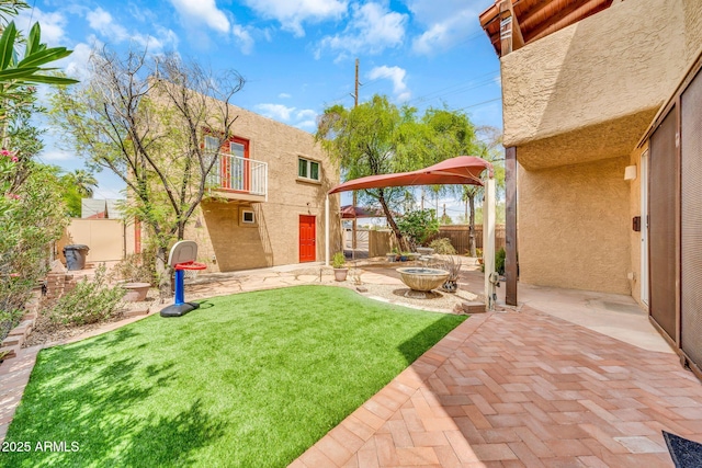 view of yard with a patio area and a balcony