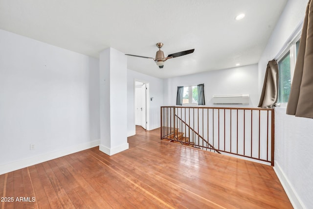 empty room featuring hardwood / wood-style floors, ceiling fan, baseboards, and recessed lighting