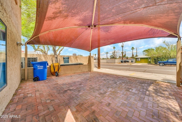view of patio featuring fence