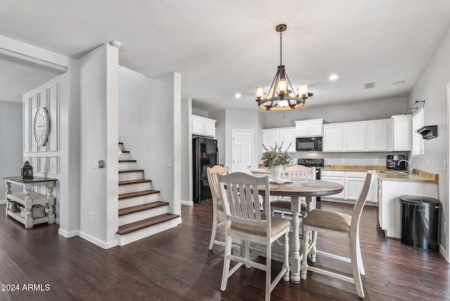 dining area featuring a chandelier and dark hardwood / wood-style floors