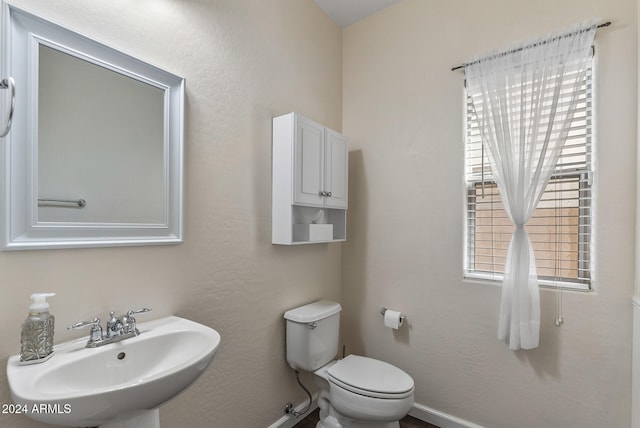 bathroom featuring sink and toilet