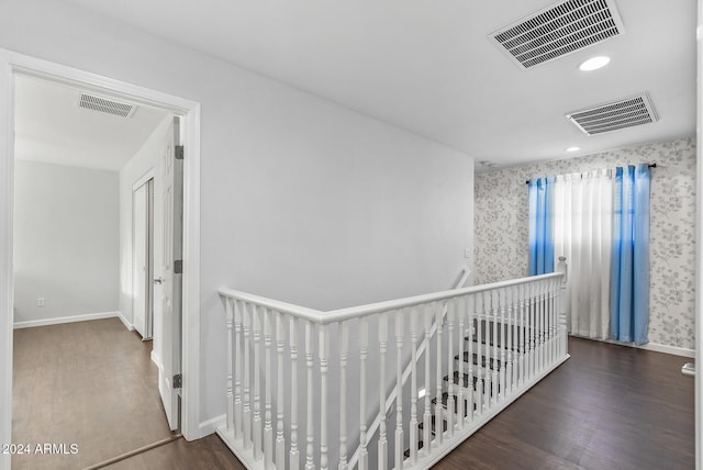 hall with dark hardwood / wood-style floors