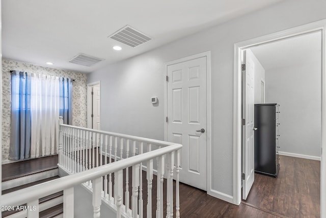 hall with dark hardwood / wood-style floors