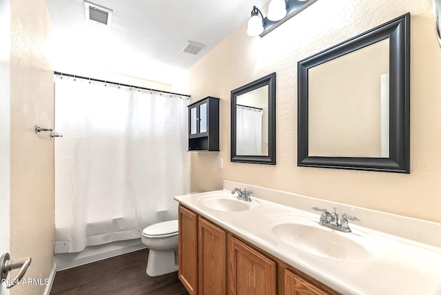 full bathroom with toilet, vanity, shower / bath combo, and hardwood / wood-style flooring