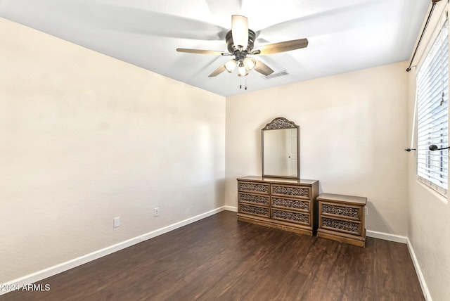 bedroom featuring ceiling fan and dark wood-type flooring