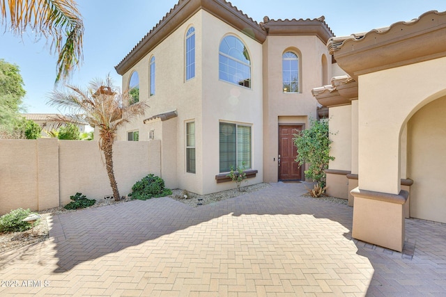 795 W Verbena Ln, Litchfield Park, AZ 85340 - rear view of property with stucco siding, fence, a patio, and a tile roof