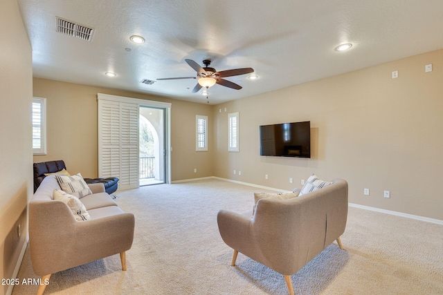795 W Verbena Ln, Litchfield Park, AZ 85340 - living area featuring carpet flooring, a ceiling fan, healthy amount of natural light, baseboards, and recessed lighting