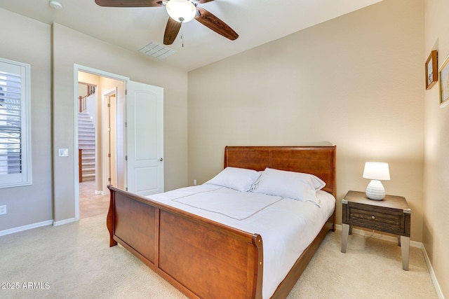 795 W Verbena Ln, Litchfield Park, AZ 85340 - bedroom with light colored carpet, baseboards, ceiling fan, and vaulted ceiling