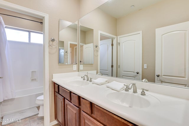 795 W Verbena Ln, Litchfield Park, AZ 85340 - full bathroom featuring toilet, double vanity, tile patterned flooring, and bathtub / shower combination