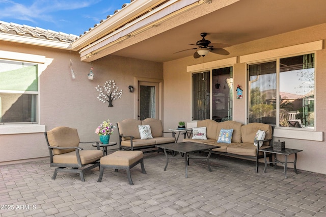 view of patio / terrace with ceiling fan and outdoor lounge area