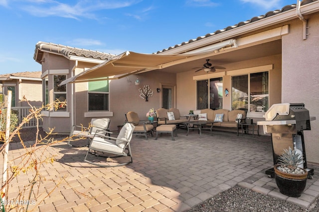 view of patio with a grill, ceiling fan, and an outdoor hangout area