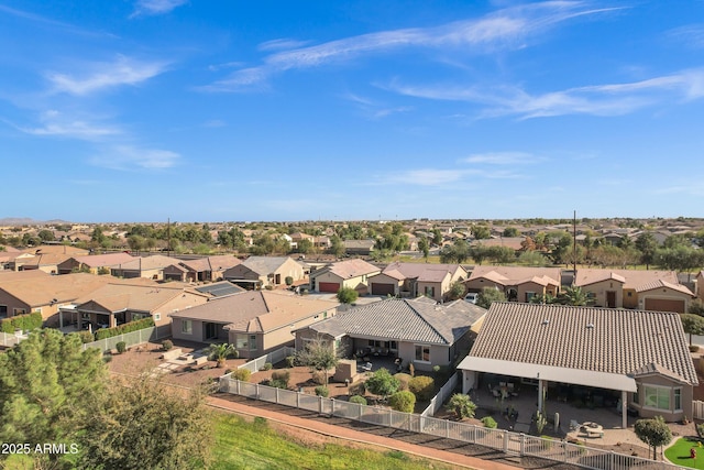 birds eye view of property with a residential view