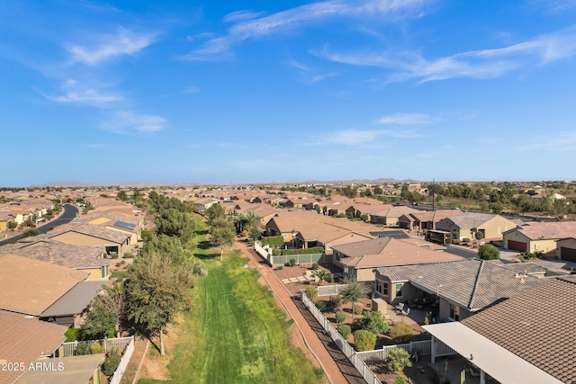 birds eye view of property with a residential view