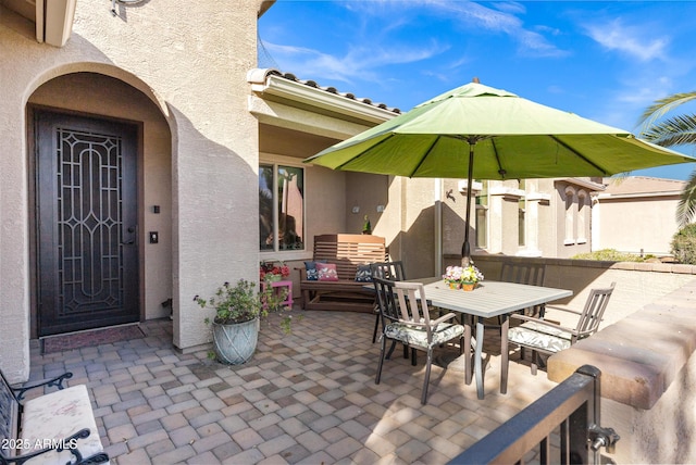 view of patio featuring outdoor dining space