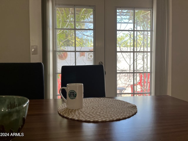 dining space featuring hardwood / wood-style floors and french doors