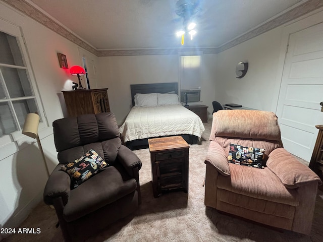 bedroom with carpet flooring and crown molding