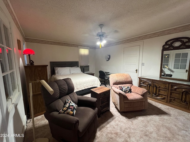 bedroom featuring a textured ceiling, crown molding, carpet flooring, and ceiling fan