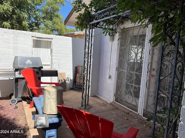 view of patio with a grill