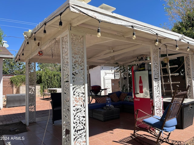 view of patio with an outdoor living space and a gazebo