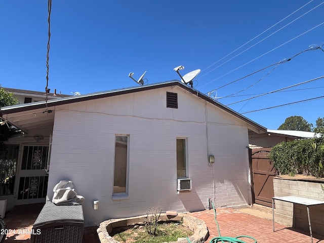 back of property with a patio and cooling unit