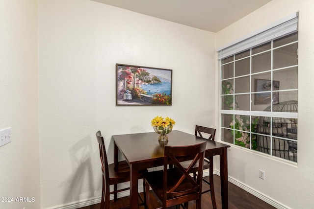 dining space featuring dark hardwood / wood-style flooring