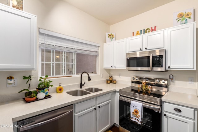 kitchen featuring sink, white cabinetry, and appliances with stainless steel finishes