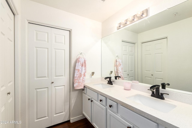 bathroom featuring hardwood / wood-style floors and vanity