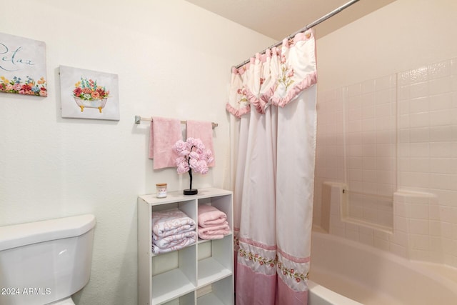 bathroom with toilet and shower / bath combo with shower curtain